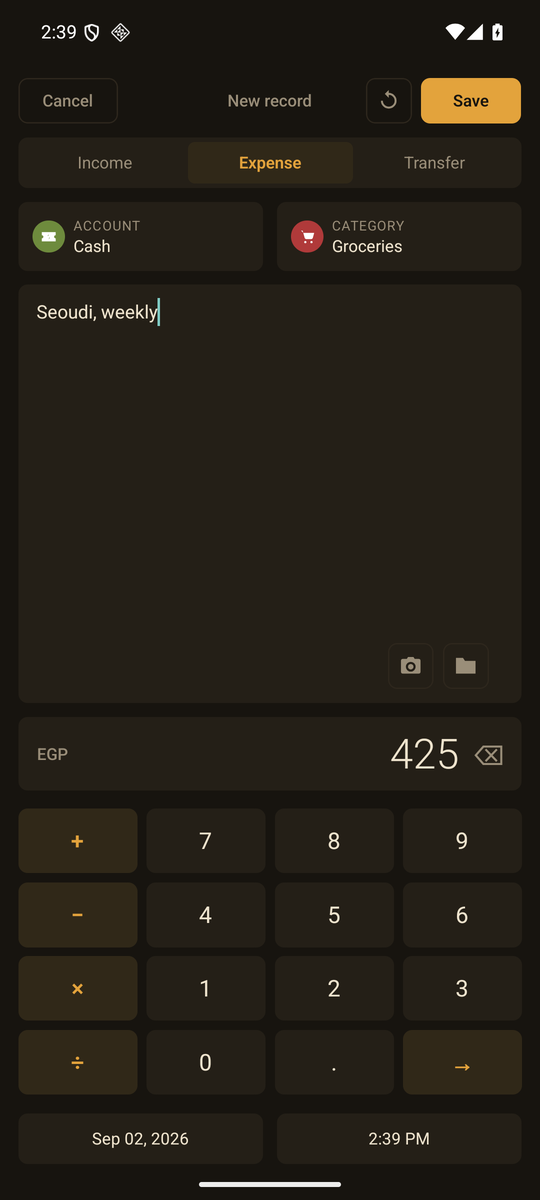 The add-record screen: account and category pickers, a note field, and the calculator keypad